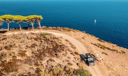 Coastal road, blue sea, jeep, people, wild nature, peace, adventure.